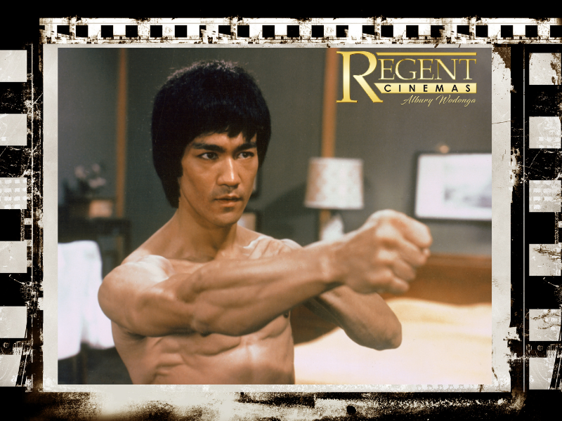 Image of Bruce Lee in punching pose taking from the film Enter the dragon.